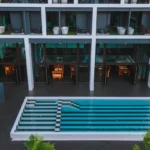 Blu Monkey Hub & Hotel Chanthaburi building and swimming pool
